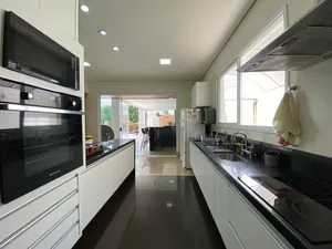 Sobrado de 4 suítes com piscina aquecida e espaço gourmet completo em condomínio tradicional — miniatura 15