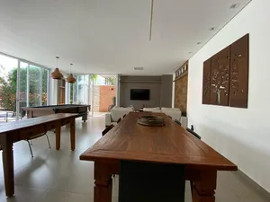 Sobrado de 4 suítes com piscina aquecida e espaço gourmet completo em condomínio tradicional — miniatura 18
